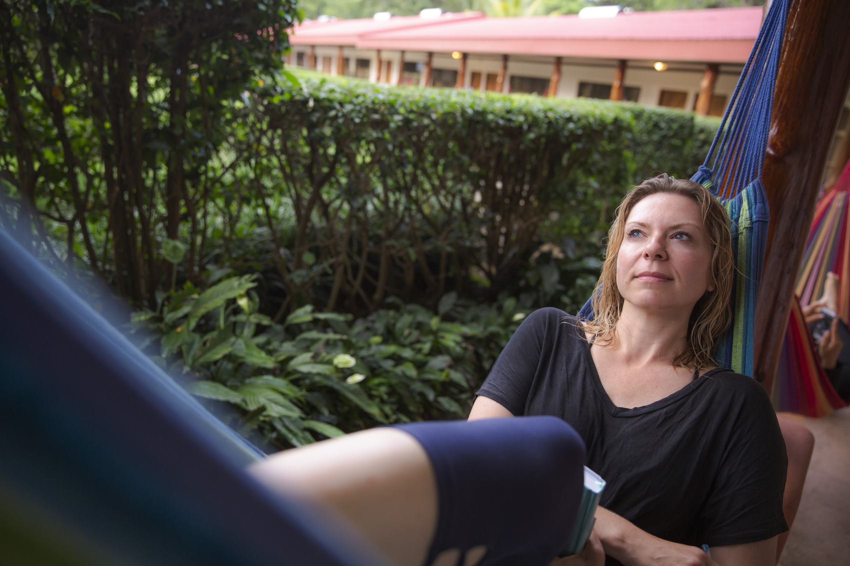 A woman relaxing in a hammock contemplating life